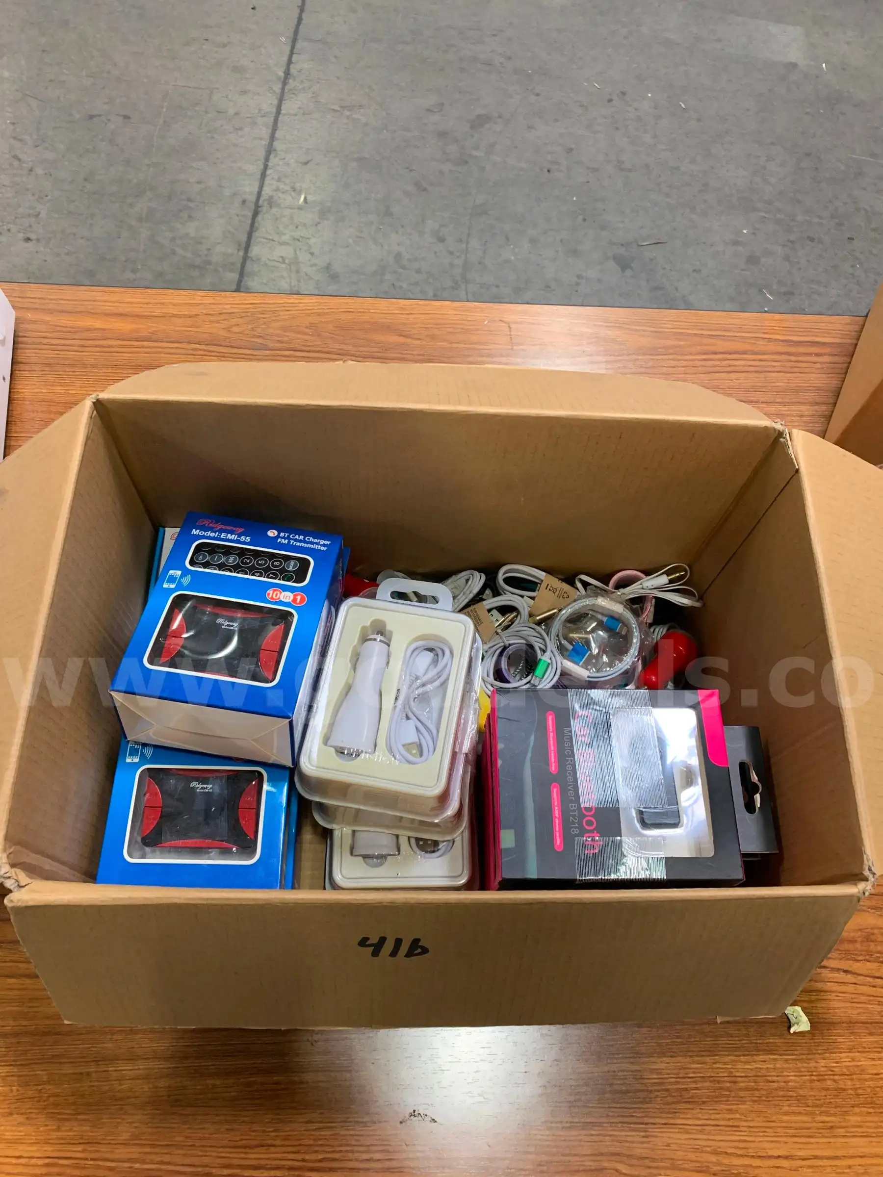 Box of Chargers and Bluetooth Transmitters