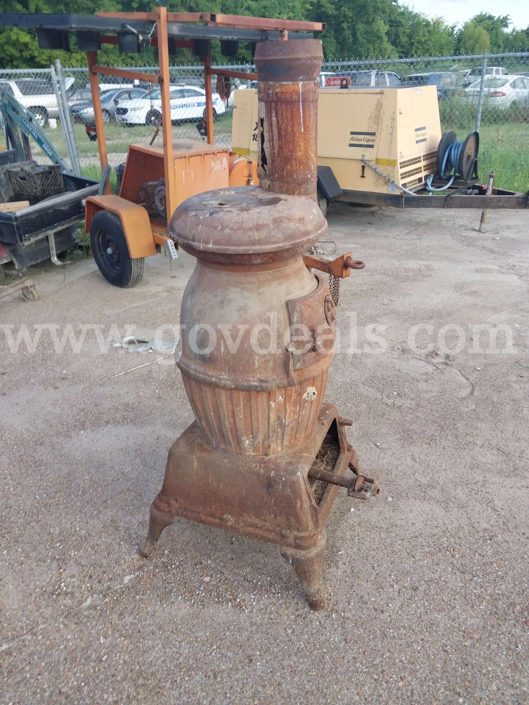 Vintage Cast Iron Potbelly Stove with Vertical Chimney Flue