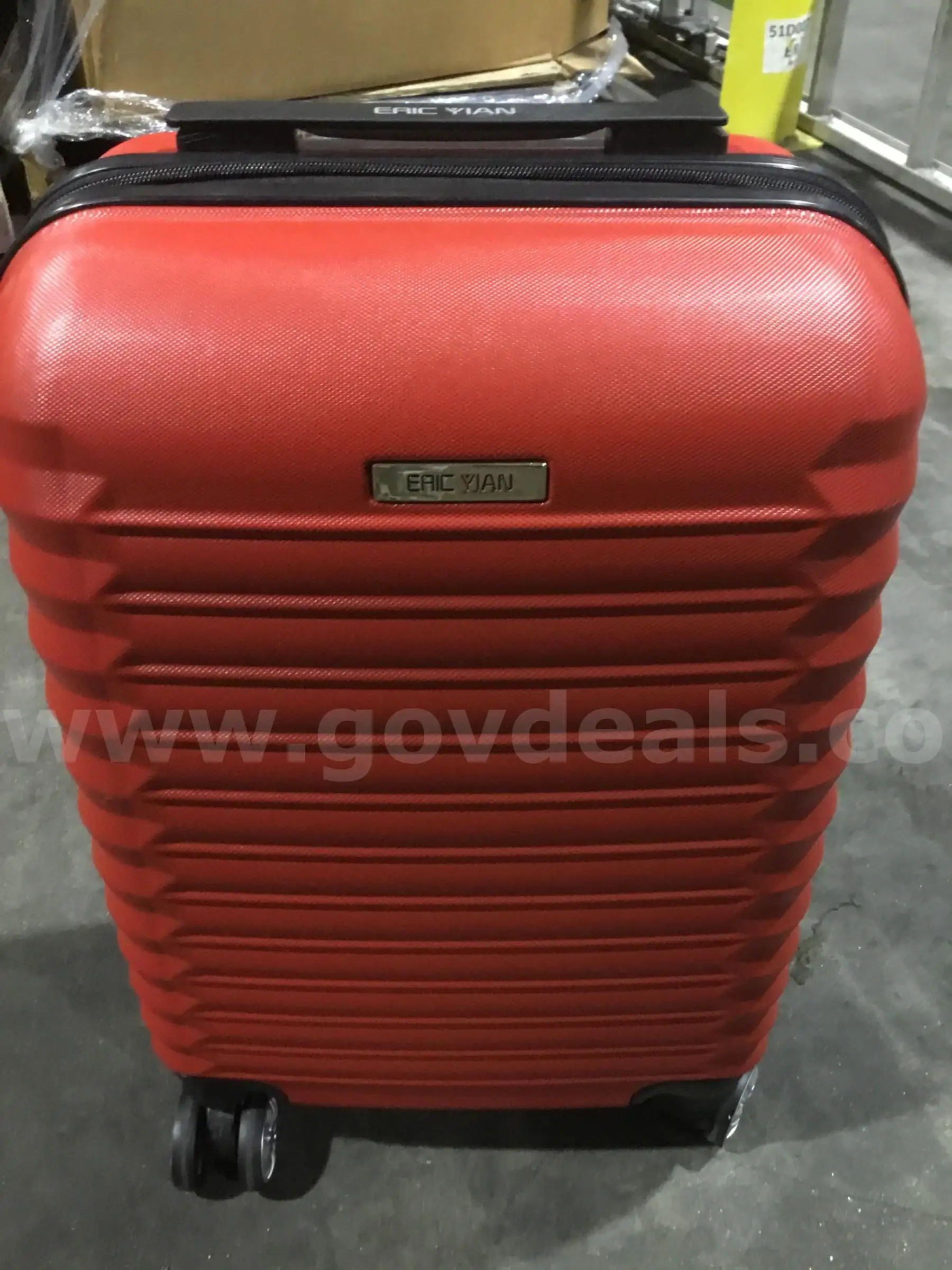Red Eric Yian luggage bag “DH”