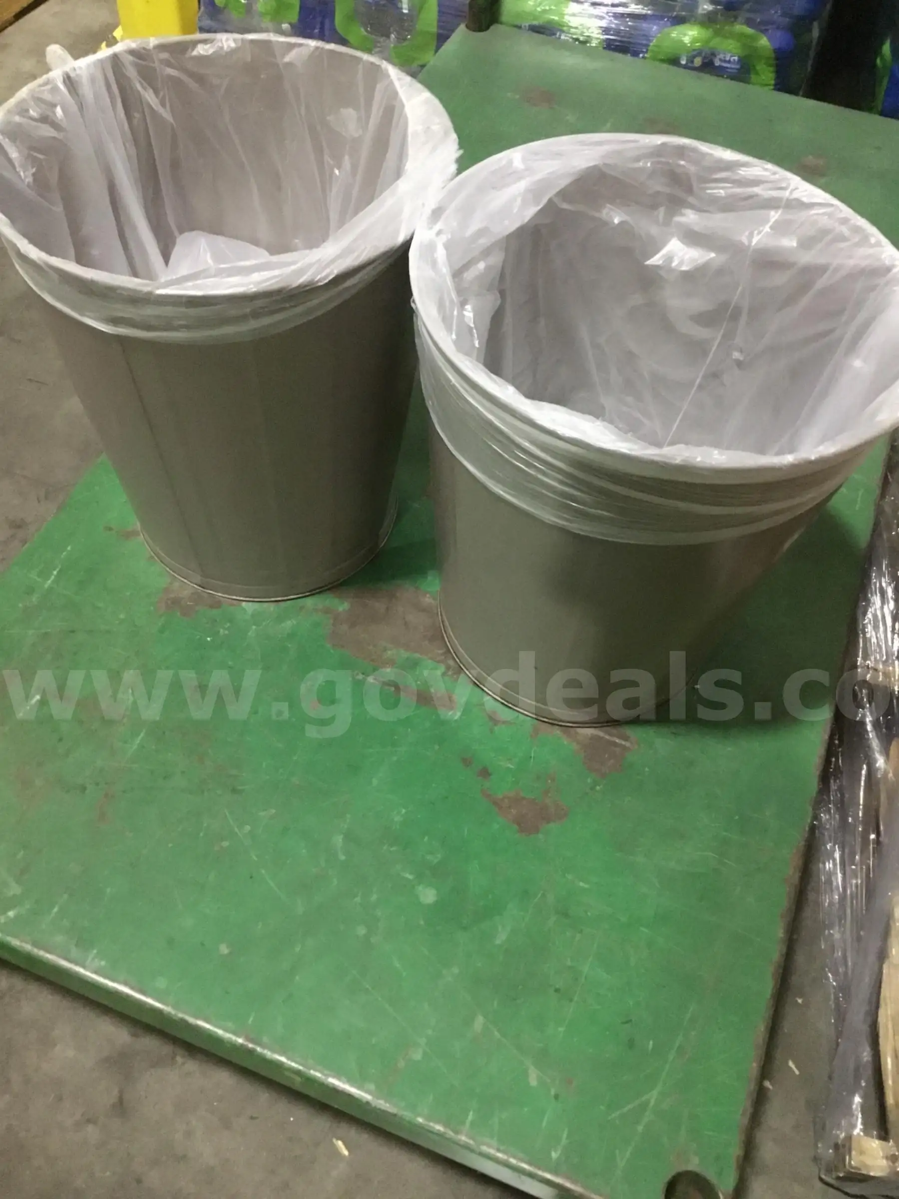 Two trash cans “DH”