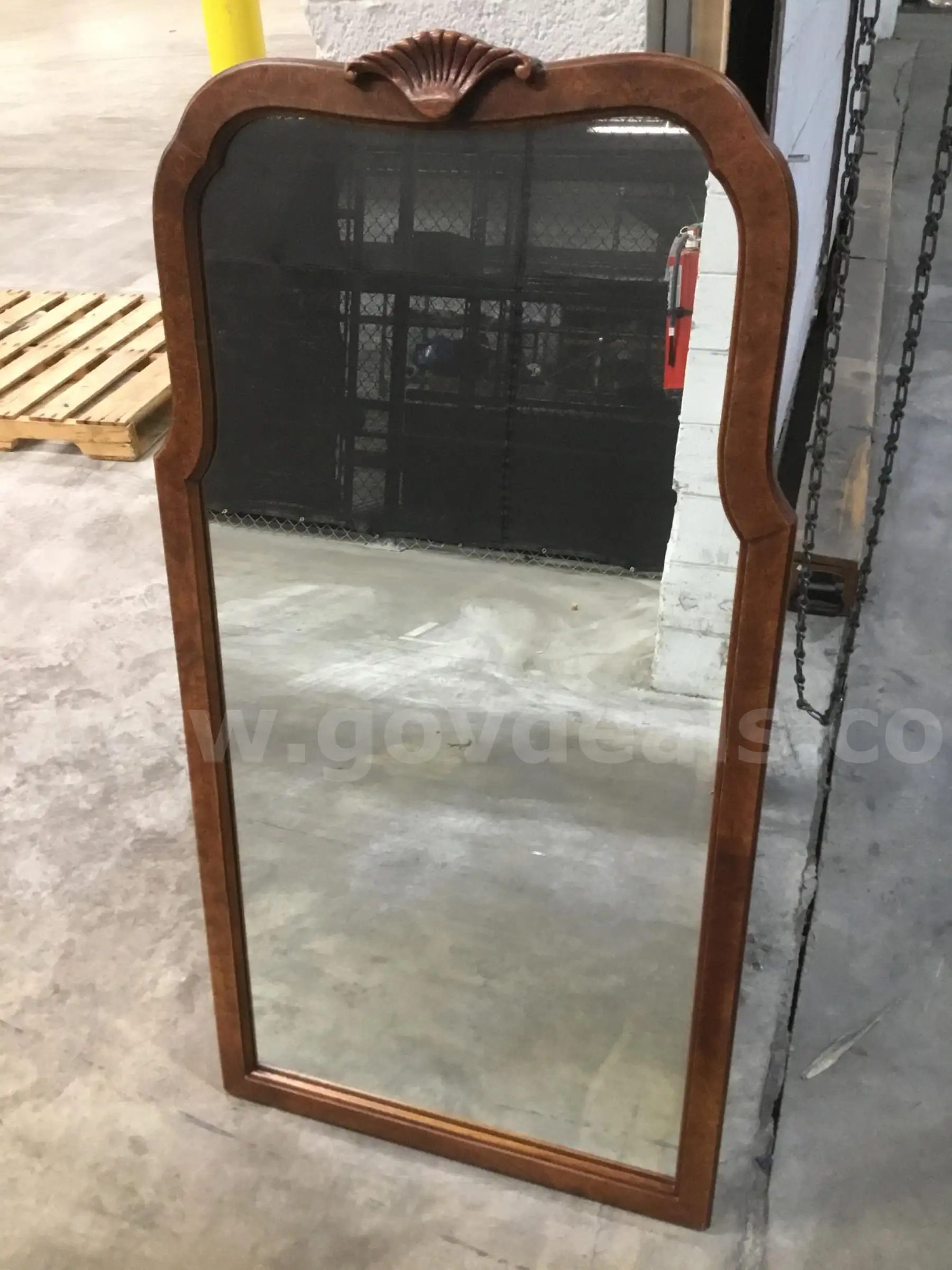 25 (LENGTH) x 48 (HEIGHT) glass mirror with a dark brown wood exterior “DH”