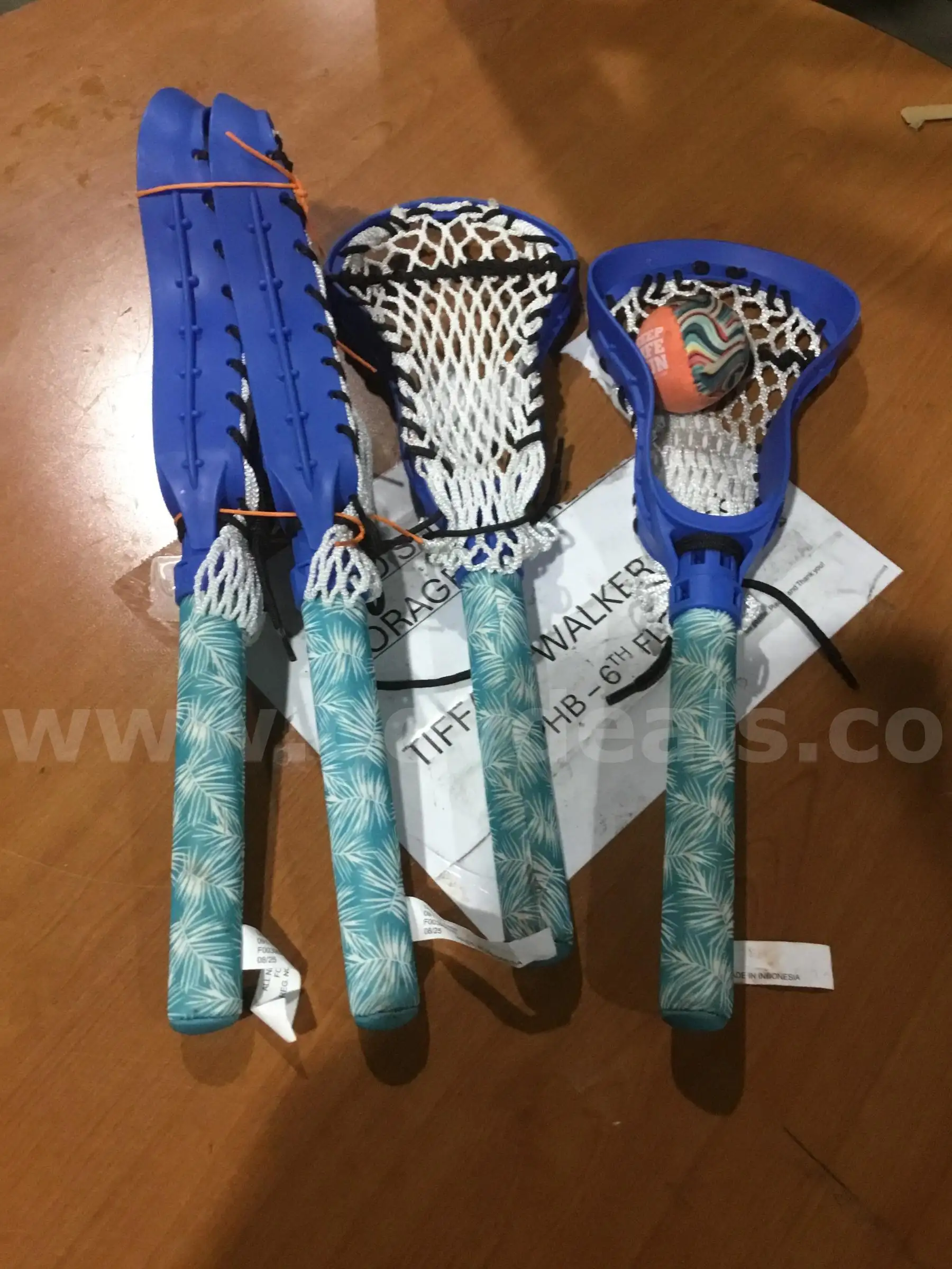 4 blue lacrosse sticks DH