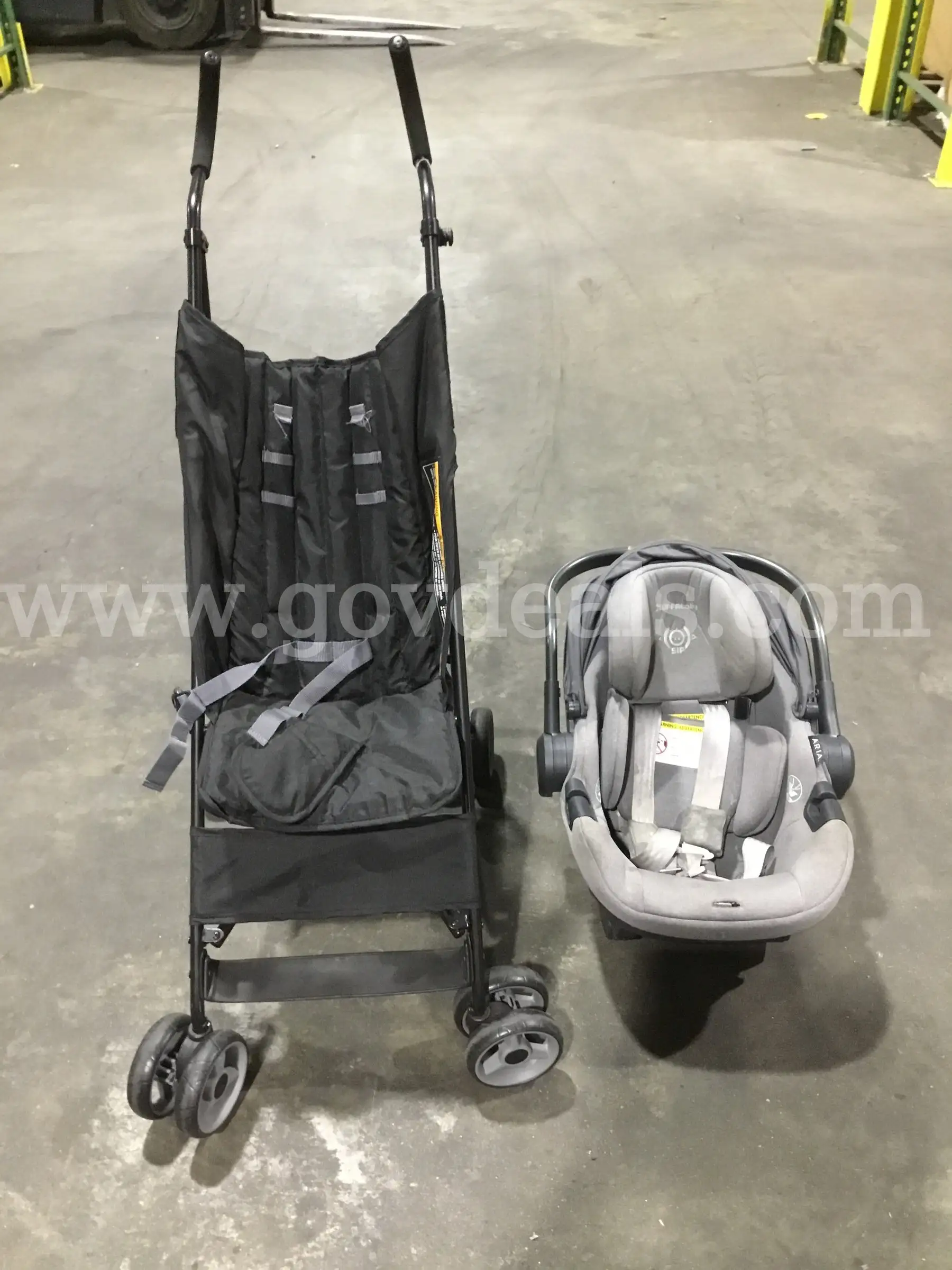 Dark gray car seat & a baby stroller DH