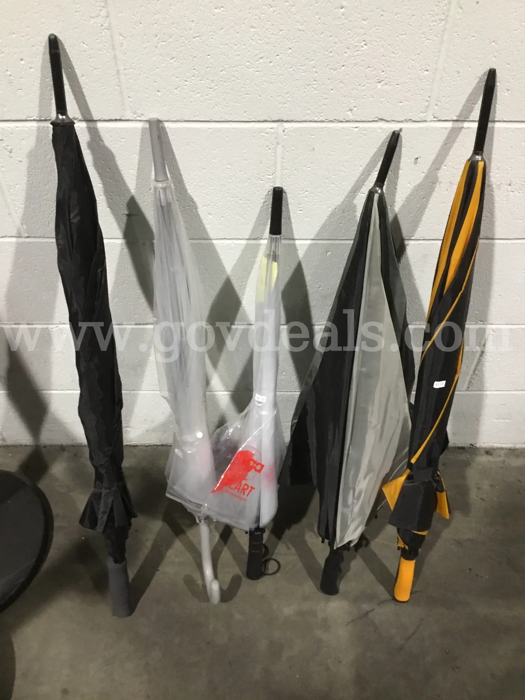5 umbrellas-orange & black striped umbrella DH