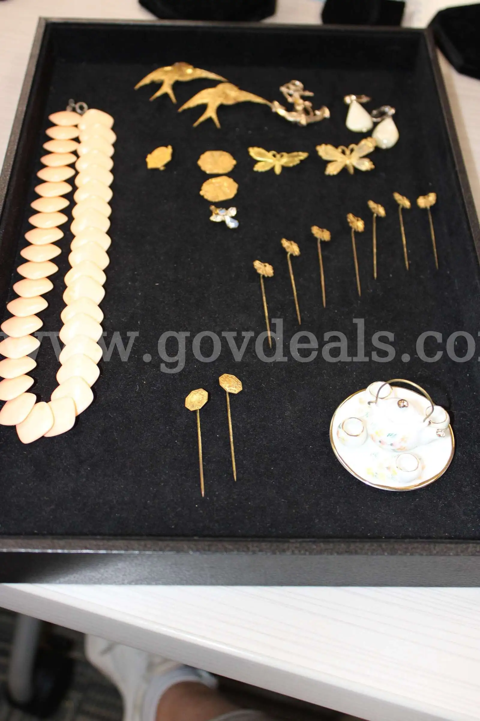 PINS (17) CHARM (1) EARRING PAIR (1) NECKLACE (1) MINI TEA SET (1)