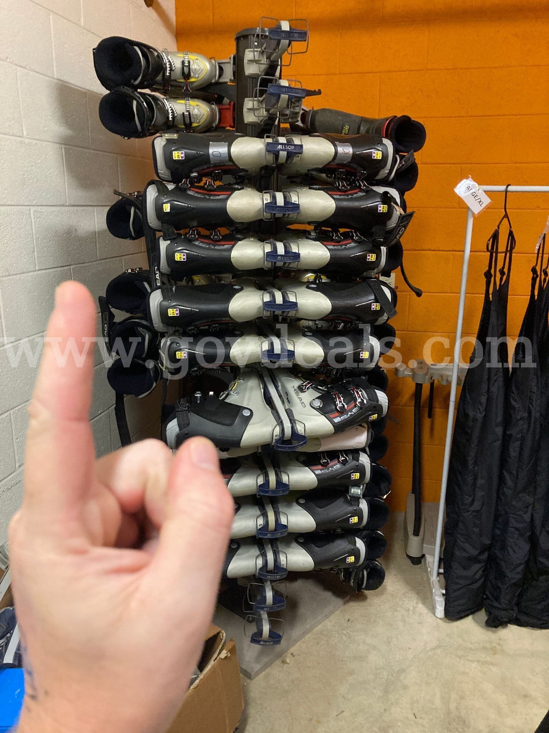 Lot of 90 Pairs of Ski Boots and 3 Spinner Boot Racks