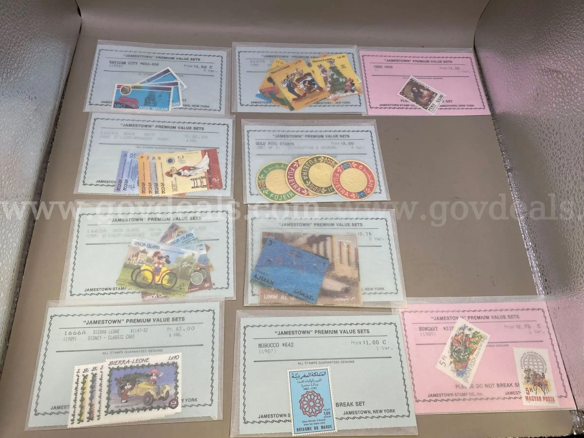 One Sheet of Steamboat .32 Stamps and Ten Jamestown Premium Sets