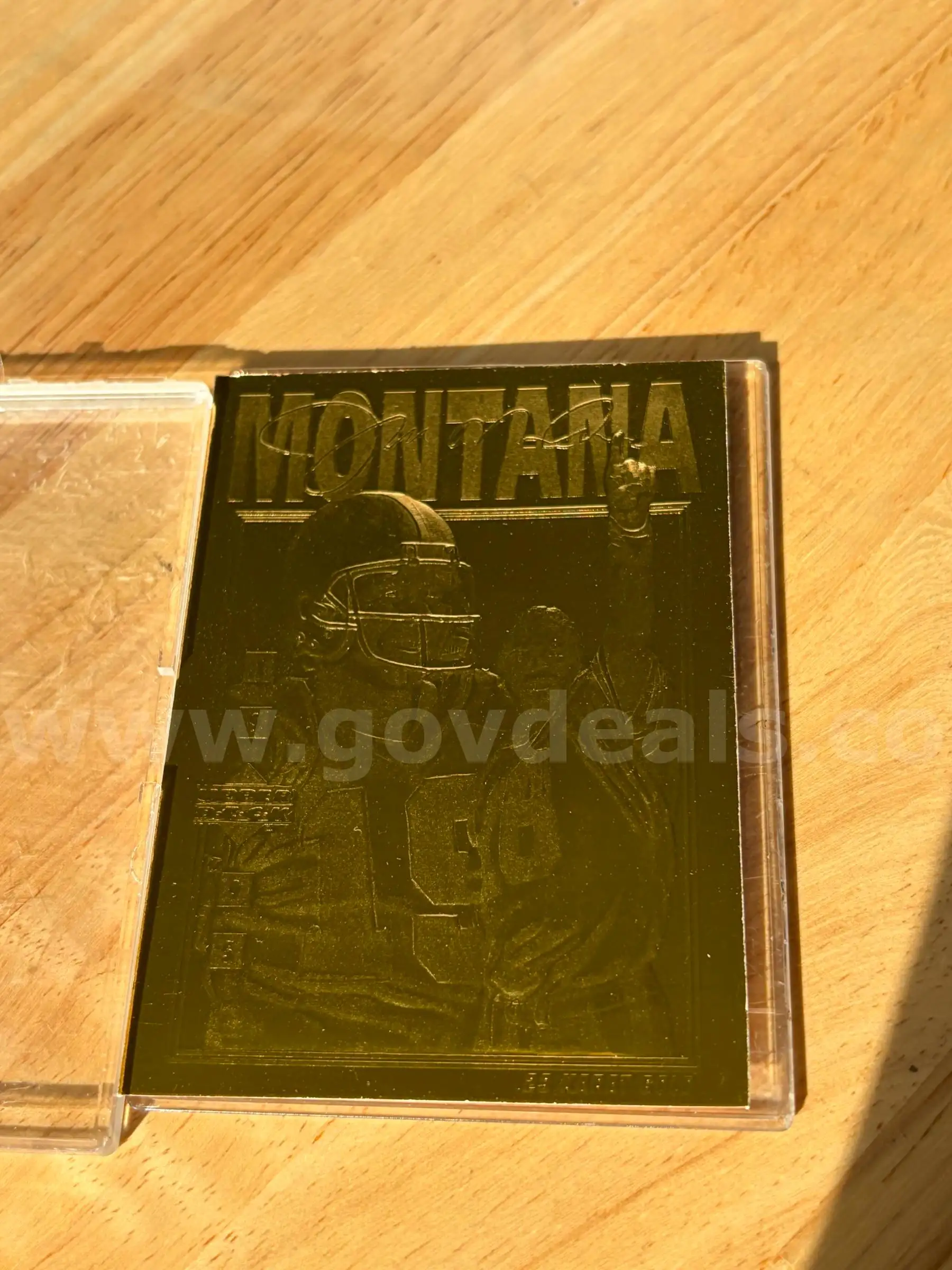TiDDRs 1995 Upper Deck Joe Montana 23-Karat Gold Foil Limited Edition trading card.