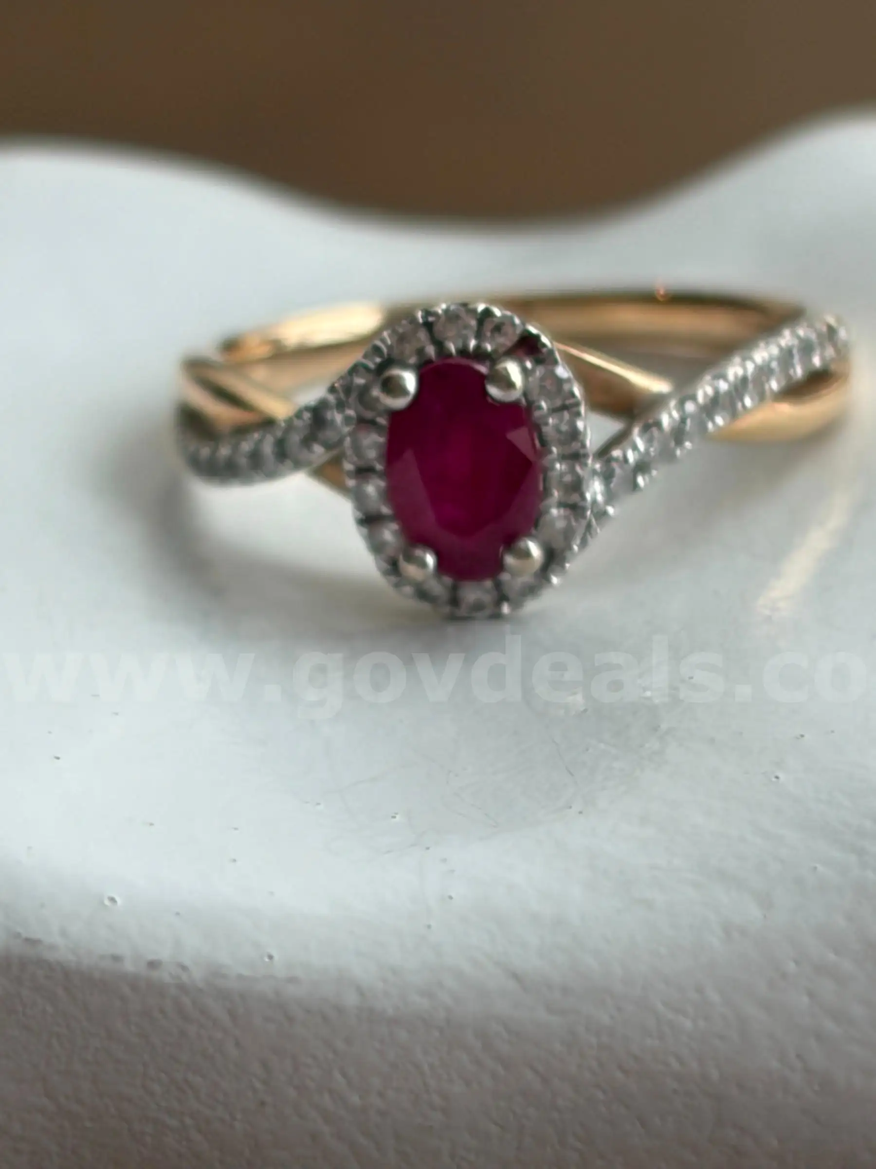 14K Gold Ring w Diamonds (0.31 CTW) and a center ruby. Size 5.25. Missing 2 diamonds - face and side