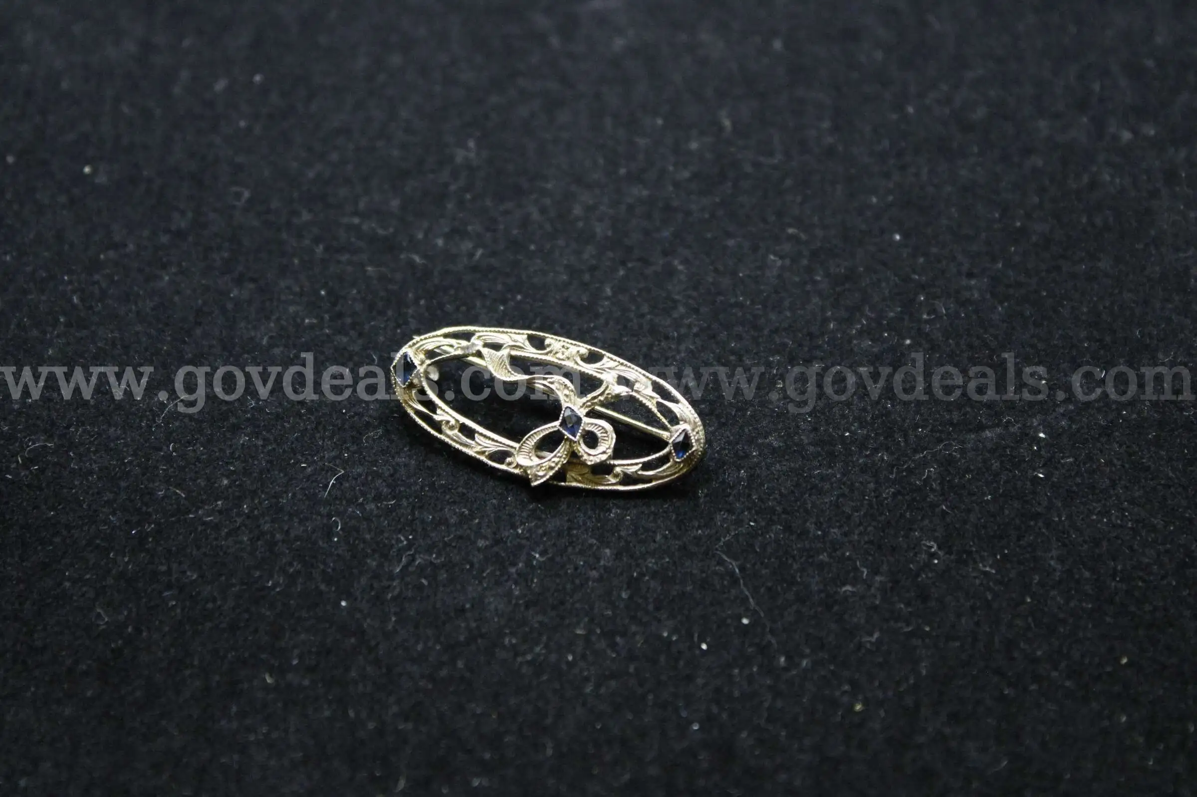 1- Silver Colored Brooch With Multiple Colored Stones