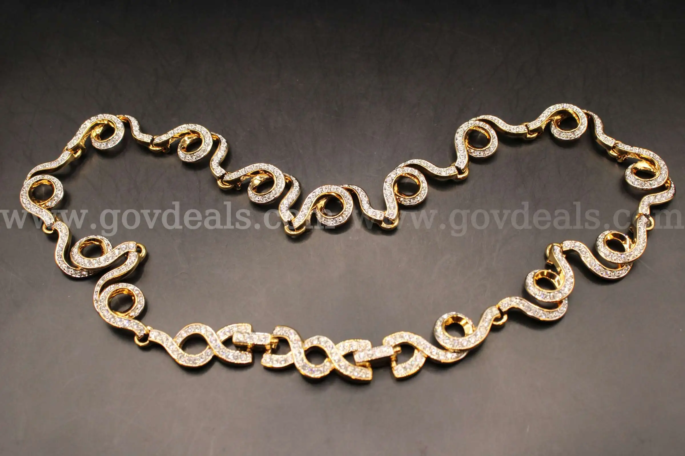 1- Gold Colored Necklace With Multiple Clear Stones