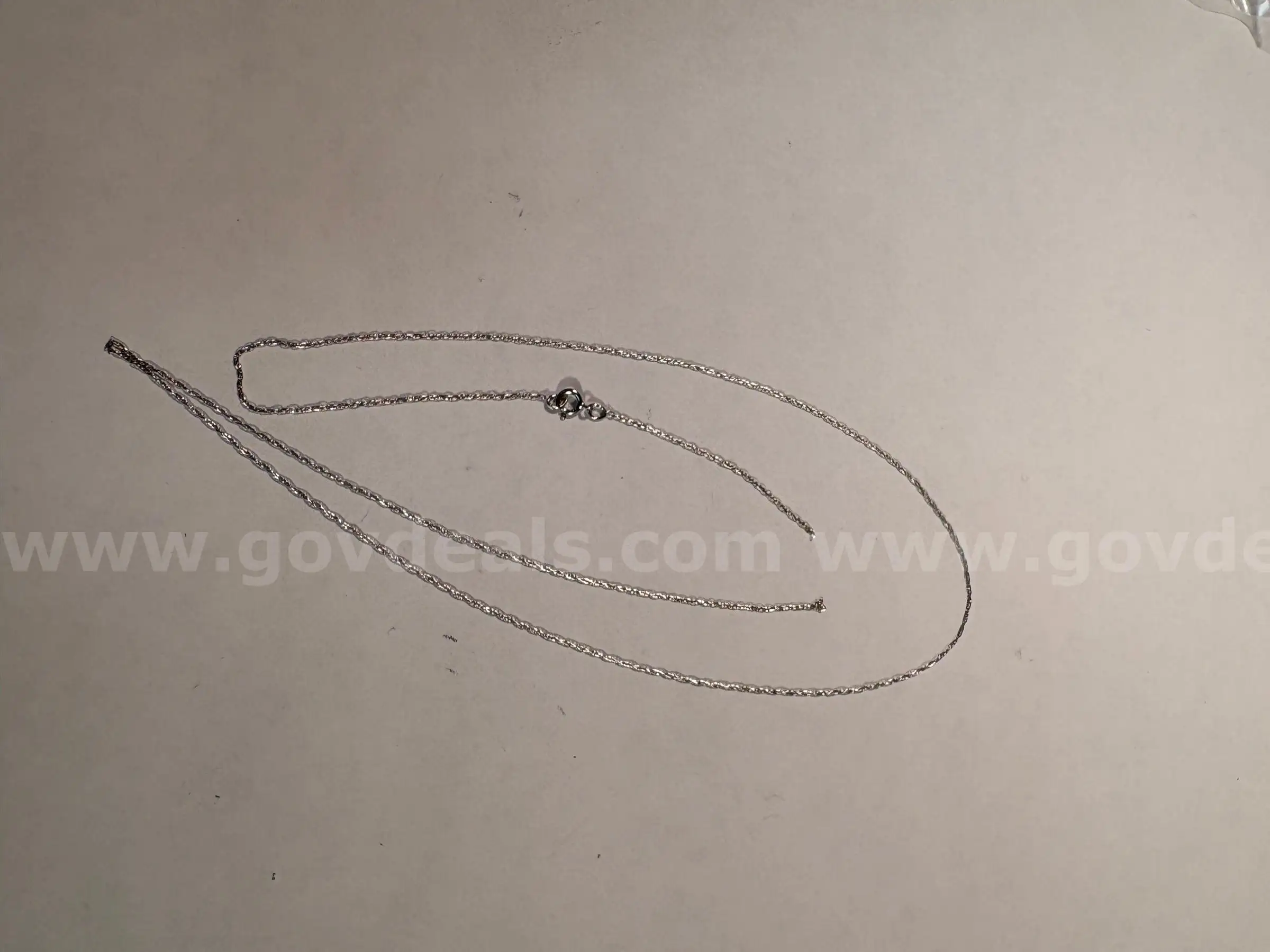 think broken 14KT stamped white gold chain