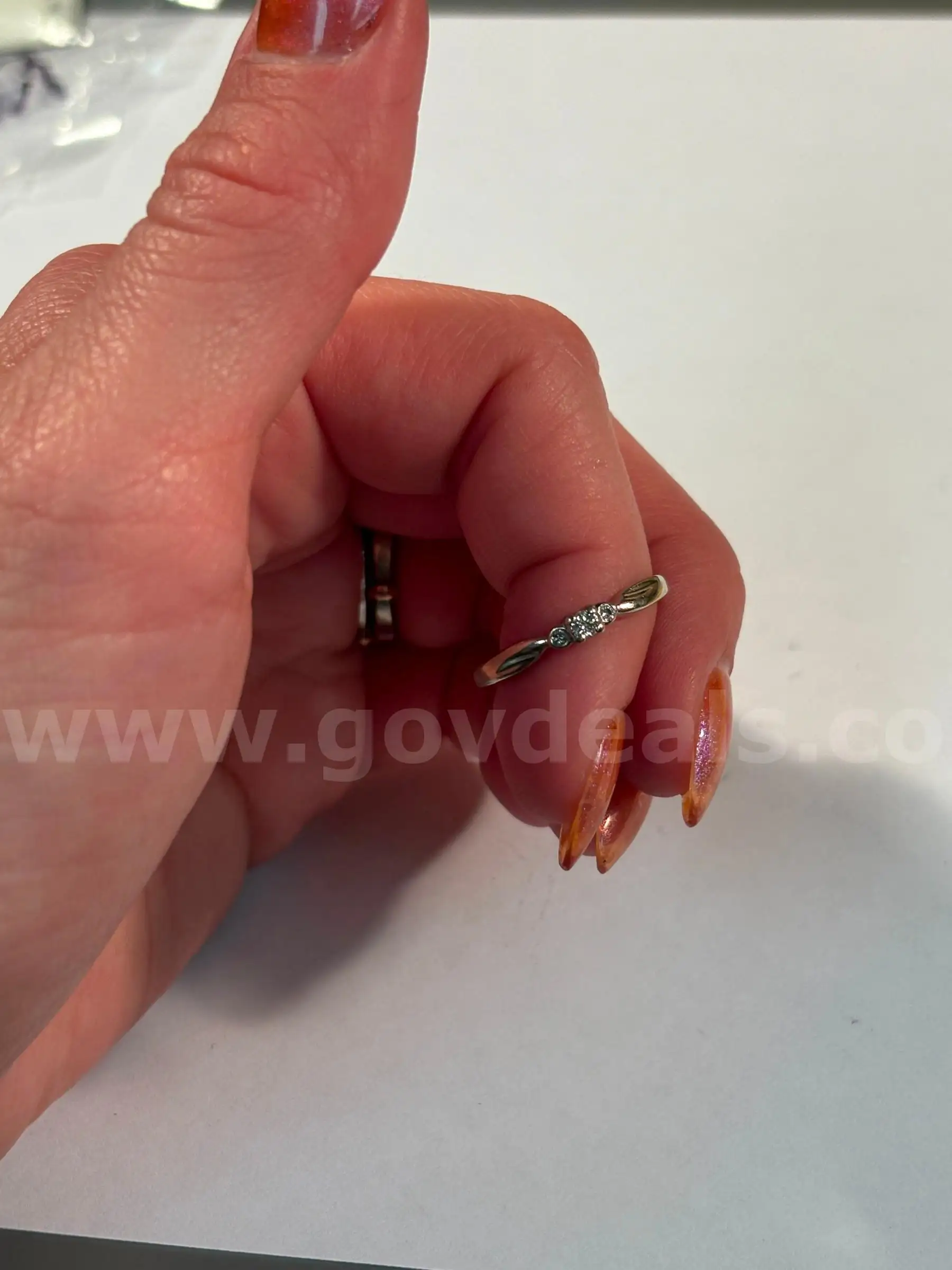 10KT white gold ring with 3 round white real diamonds