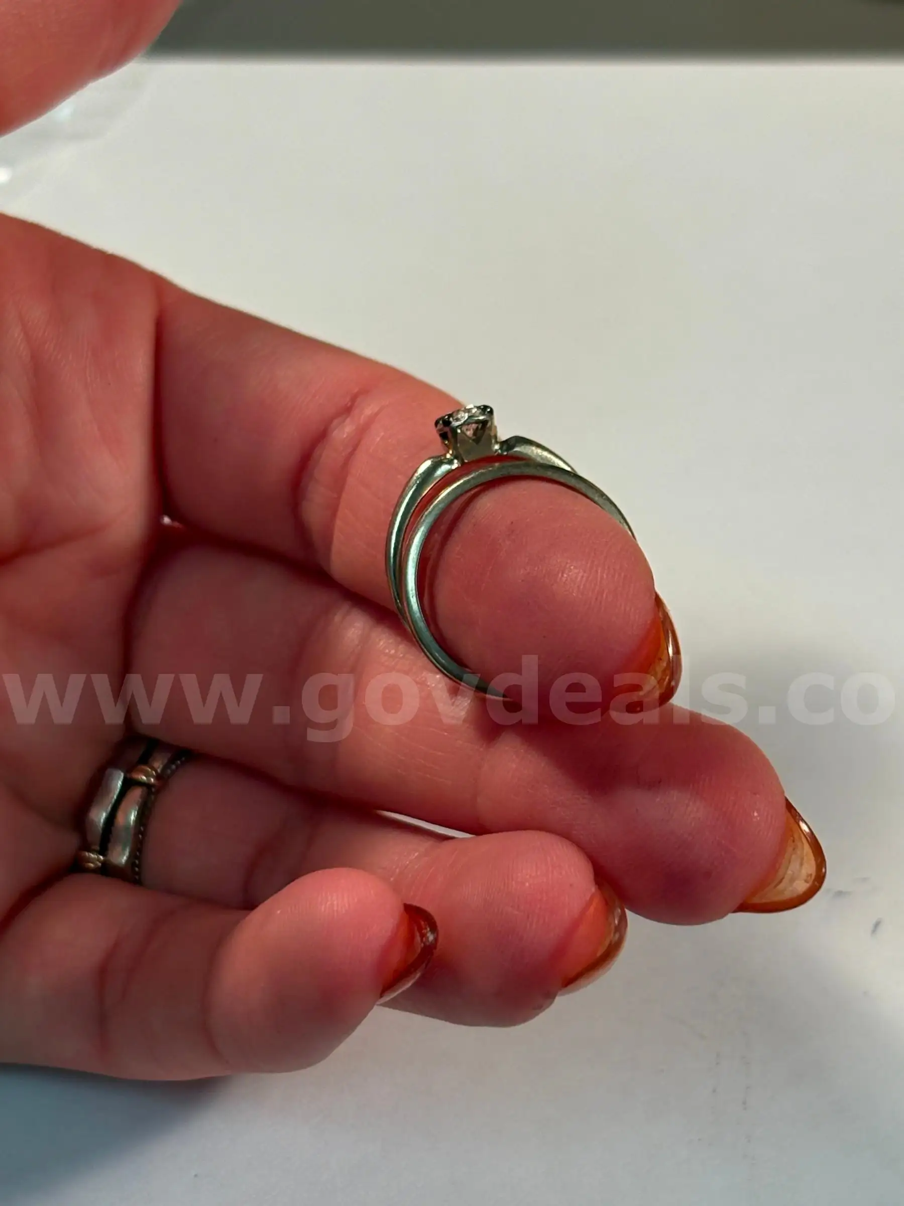 14KT white gold ring with diamond and band