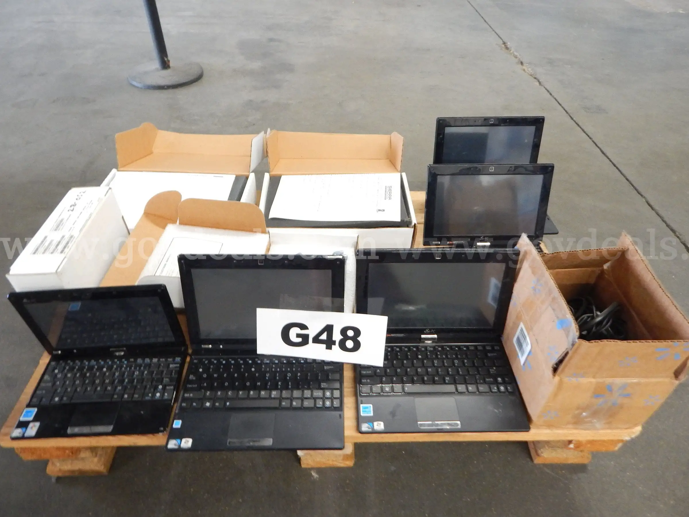 Lot G48 - (5) ASUS Laptops (4) Boxes of Misc. Electronics (1) Box of Cords
