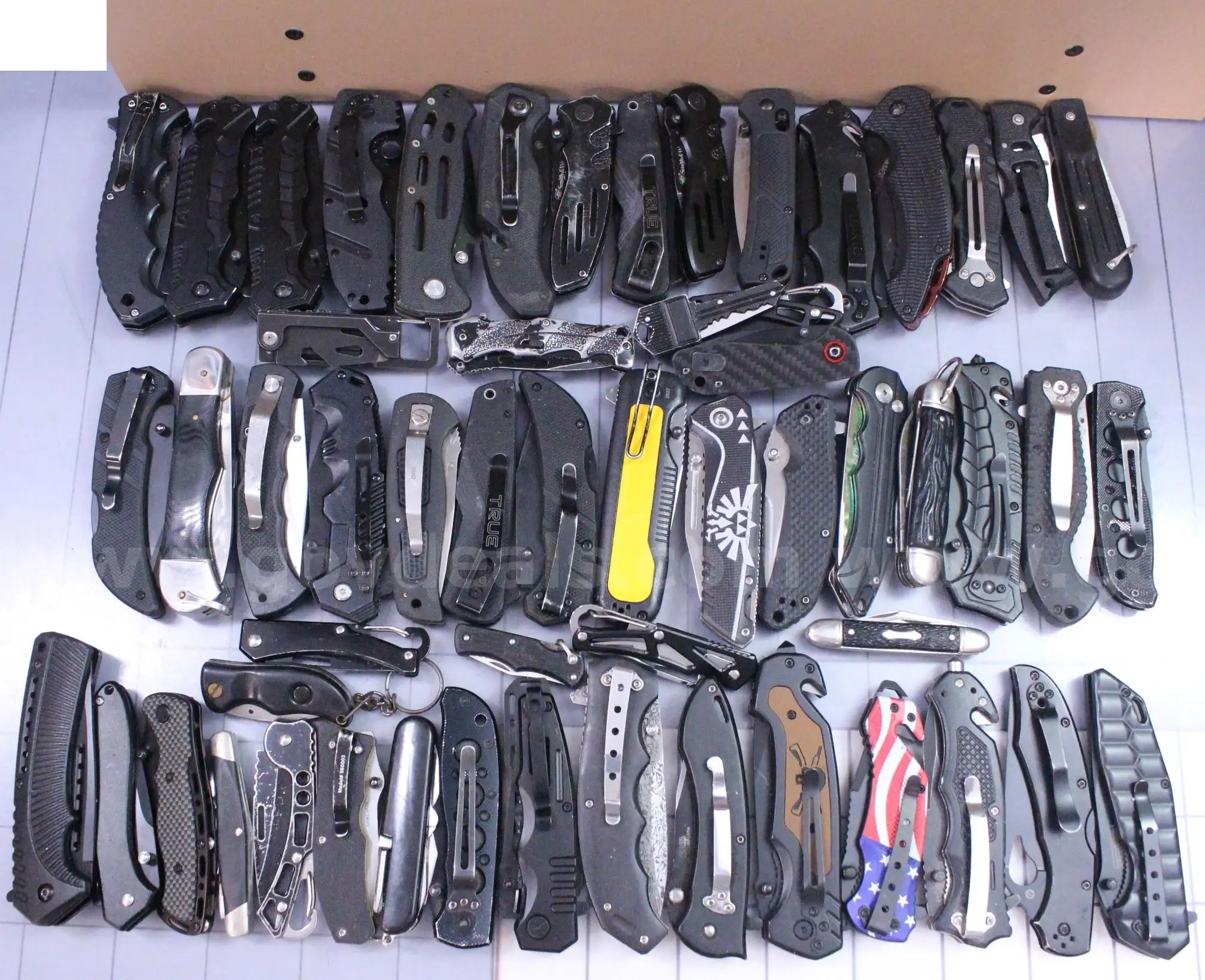 Approximately 12 lbs. of Assorted Black Knives #36303