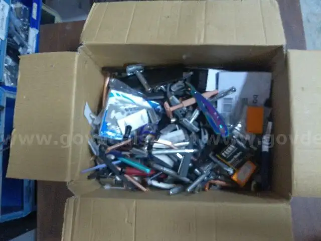 Box of razors razor blades and straight razors.