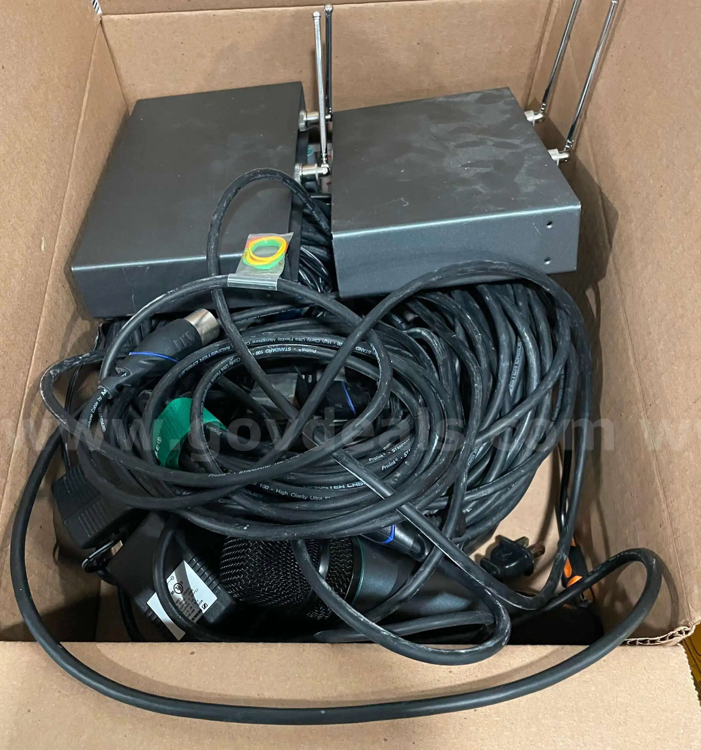 Lot of transmitters receivers cables and microphones