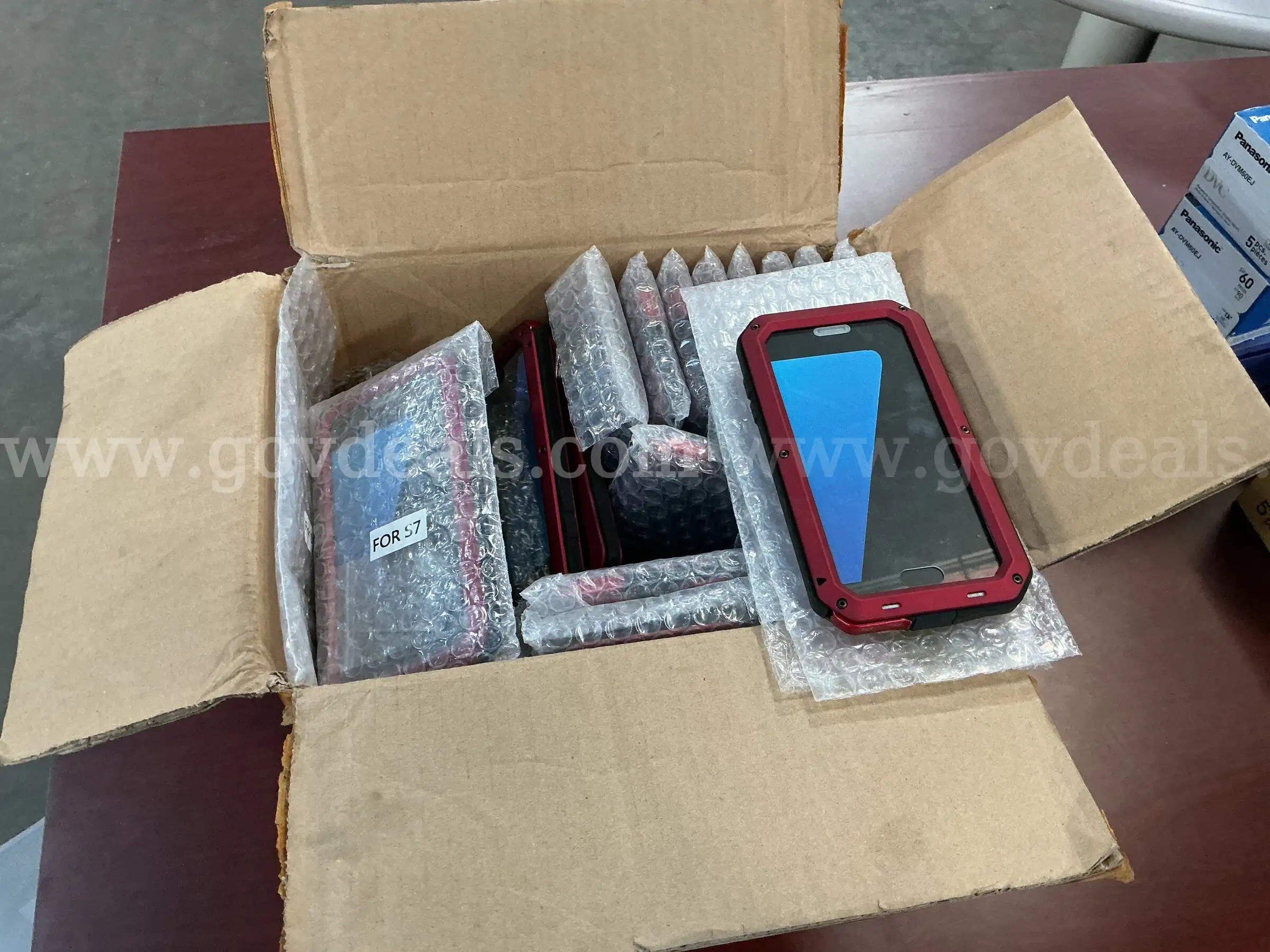 Box of Phone Cases.