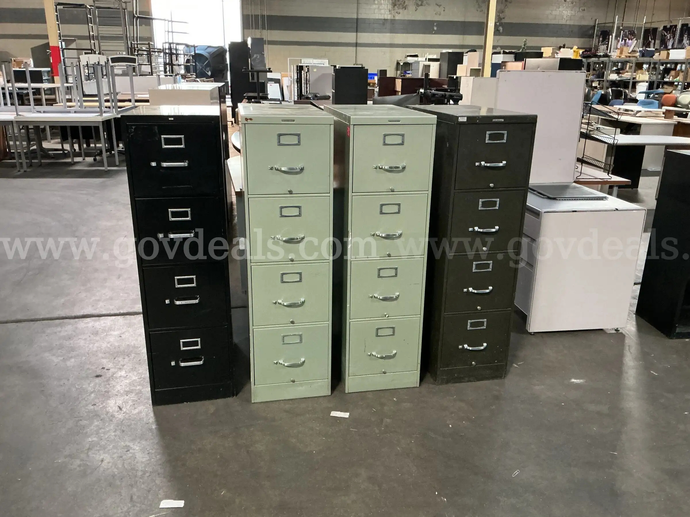 4 - 4 Drawer Filing Cabinets.