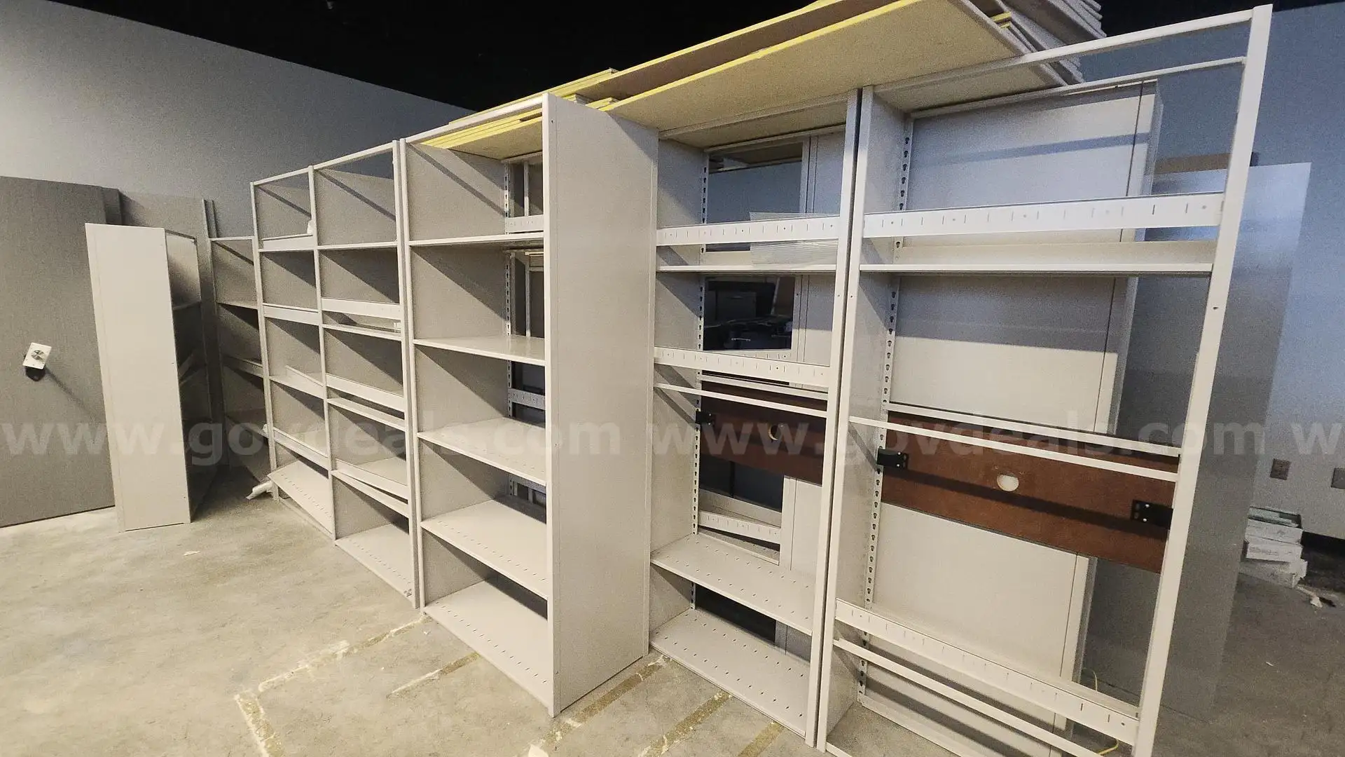 (18) Metal shelving units. Freestanding. Excellent condition.