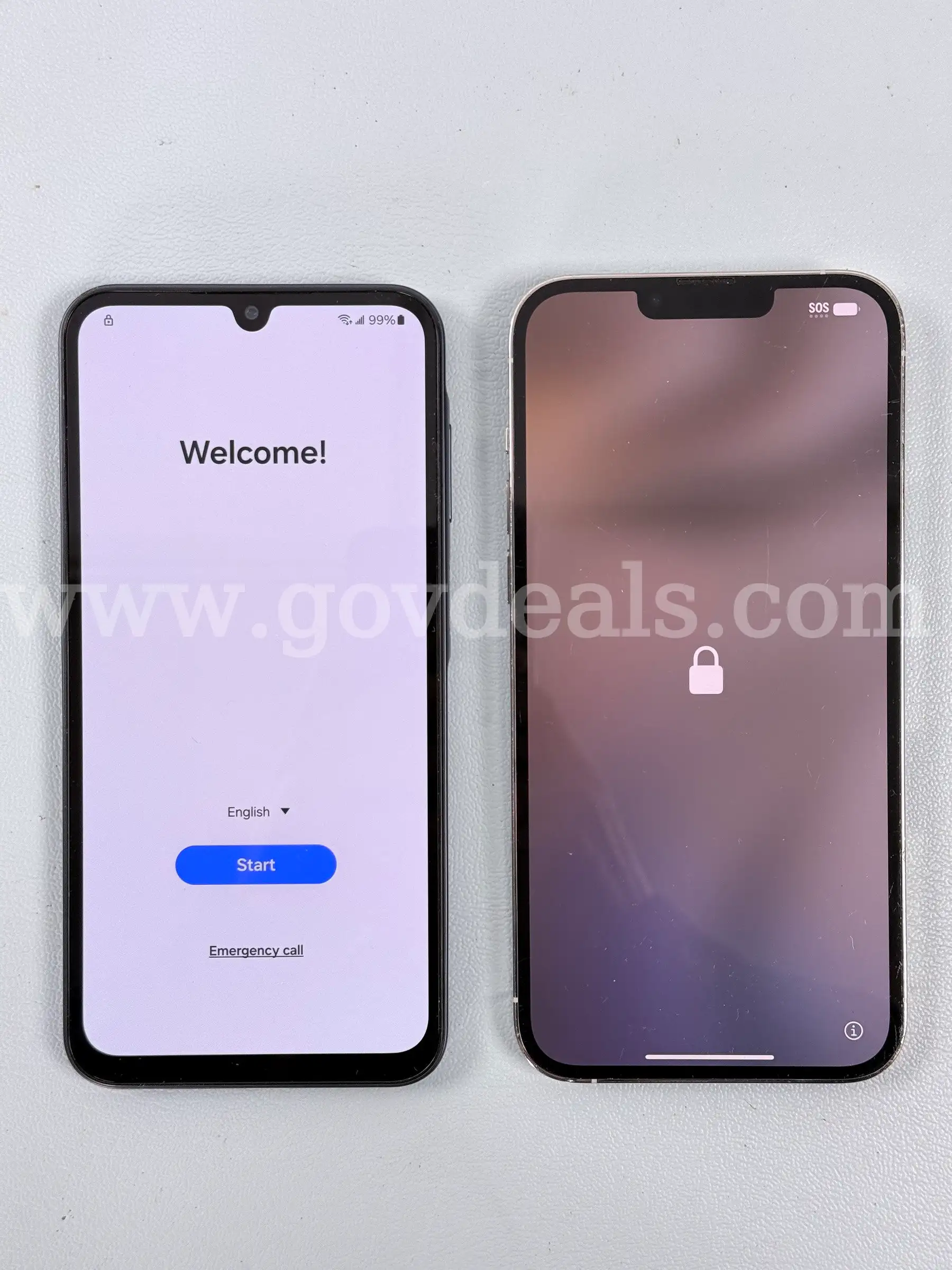 2 - Cellphones (User Locked) 1 - Apple and 1 - Samsung Both Power On