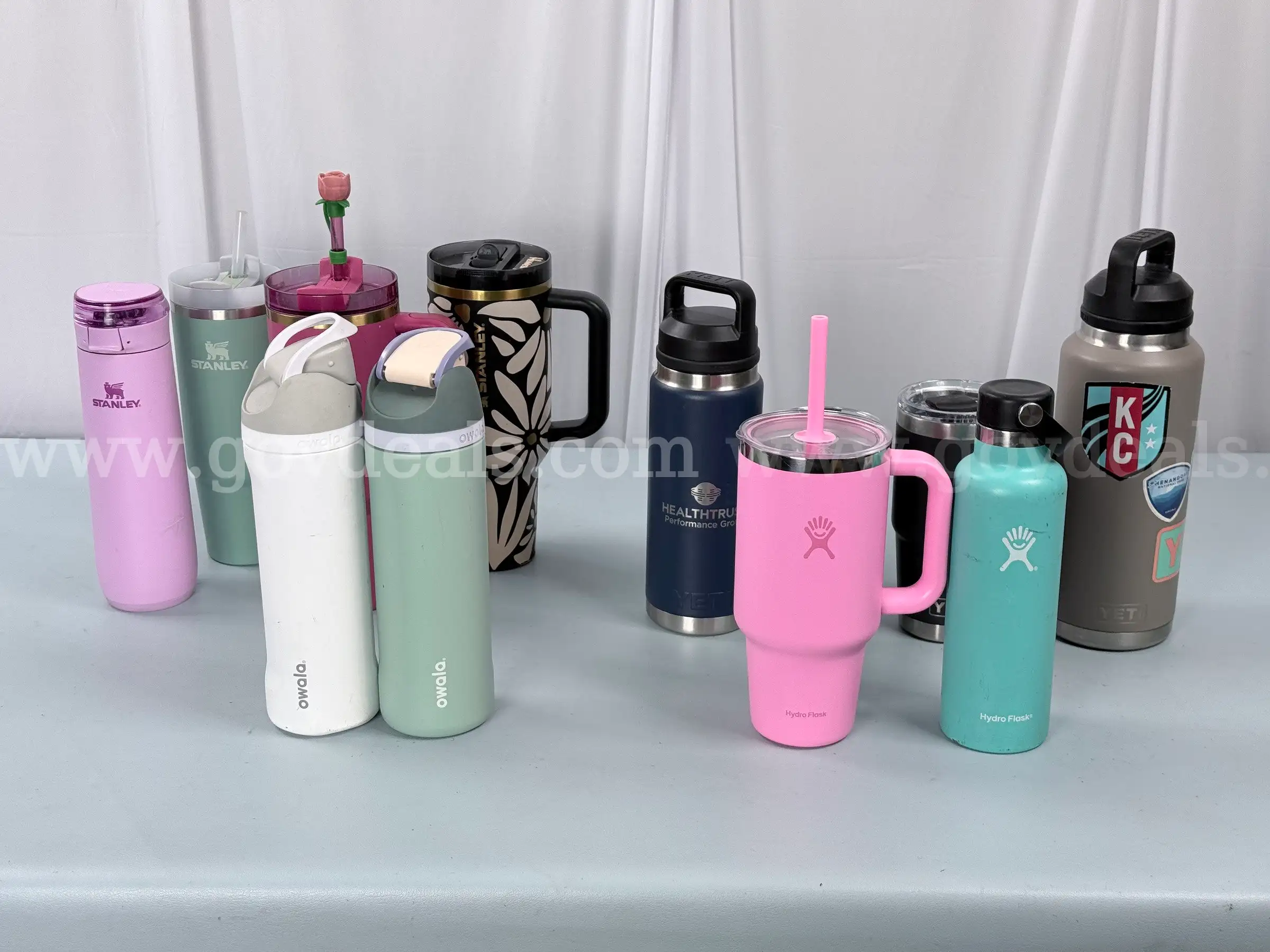 12 - Water Bottles 4 - Stanley 4 - Yeti 2 - Hydro Flask and 2 - Owala