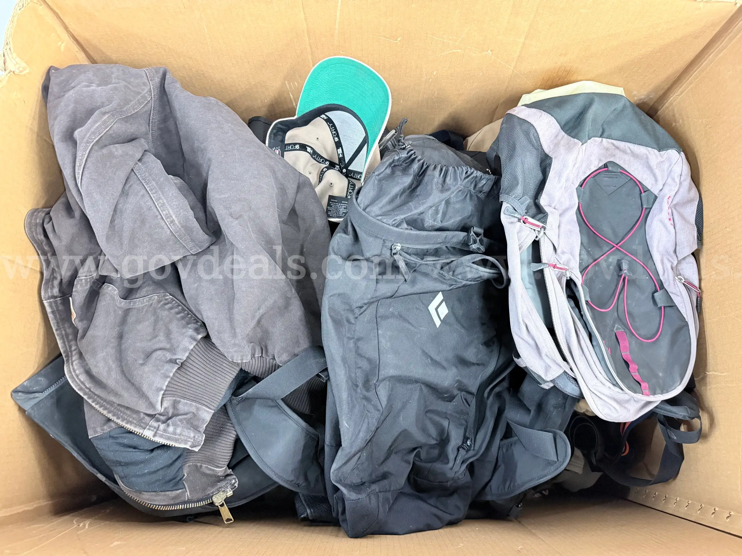 Large Box of Misc. Clothing and Backpacks Including Carhartt Spyder The North Face and More