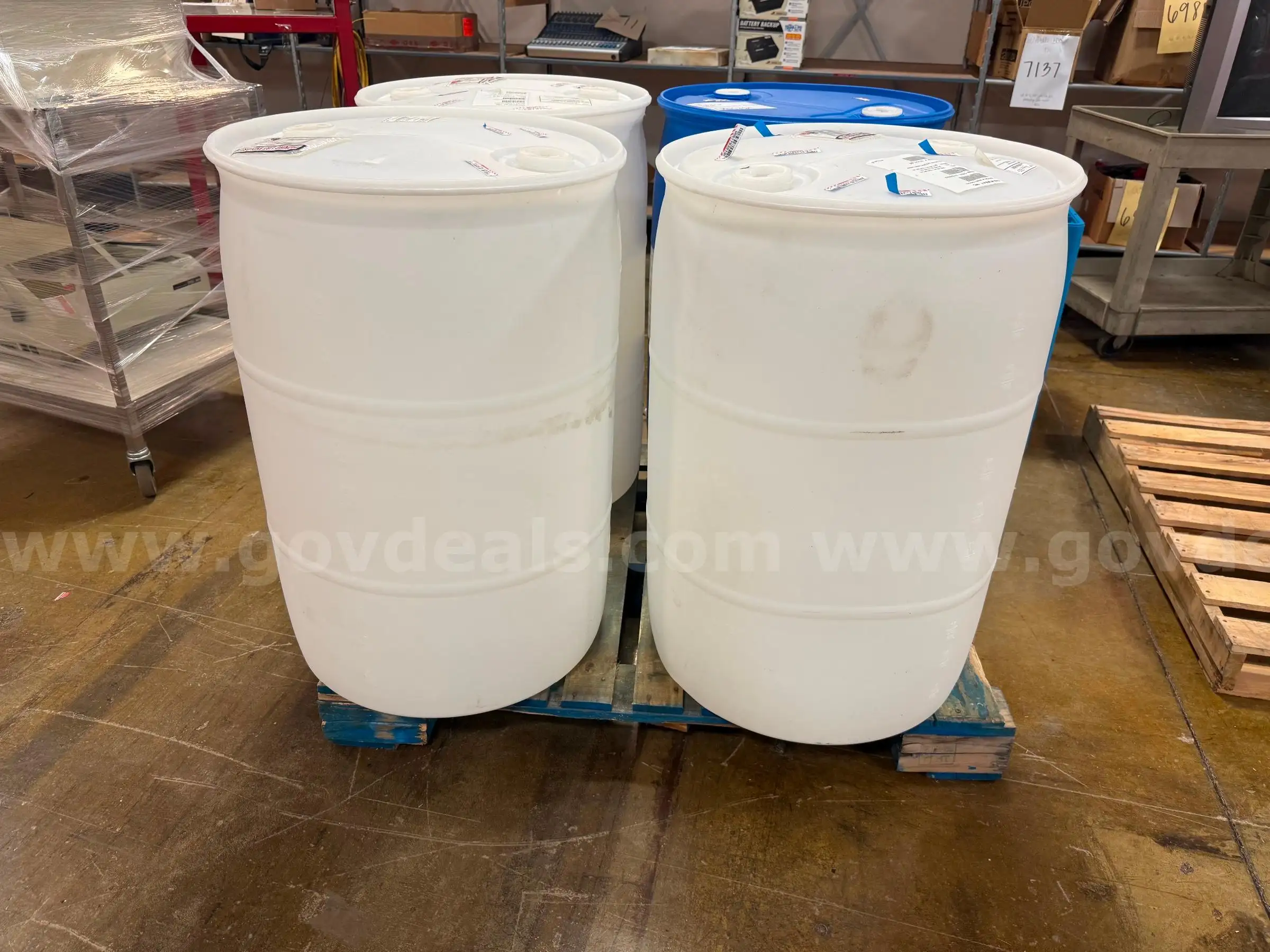 Lot of Four 55 Gallon Plastic Barrels