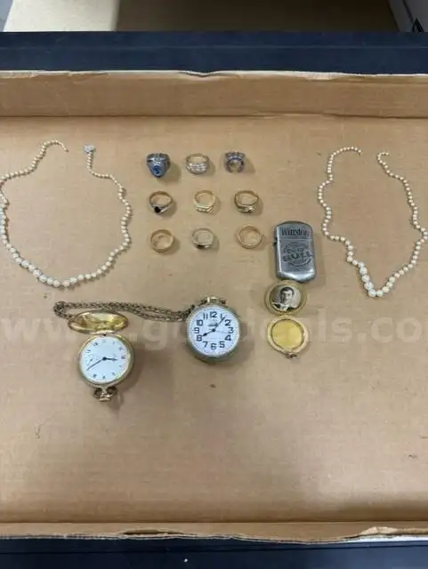 Nine Rings Two Necklaces Two Pocket Watches A Pocket Photo Holder and Lighter