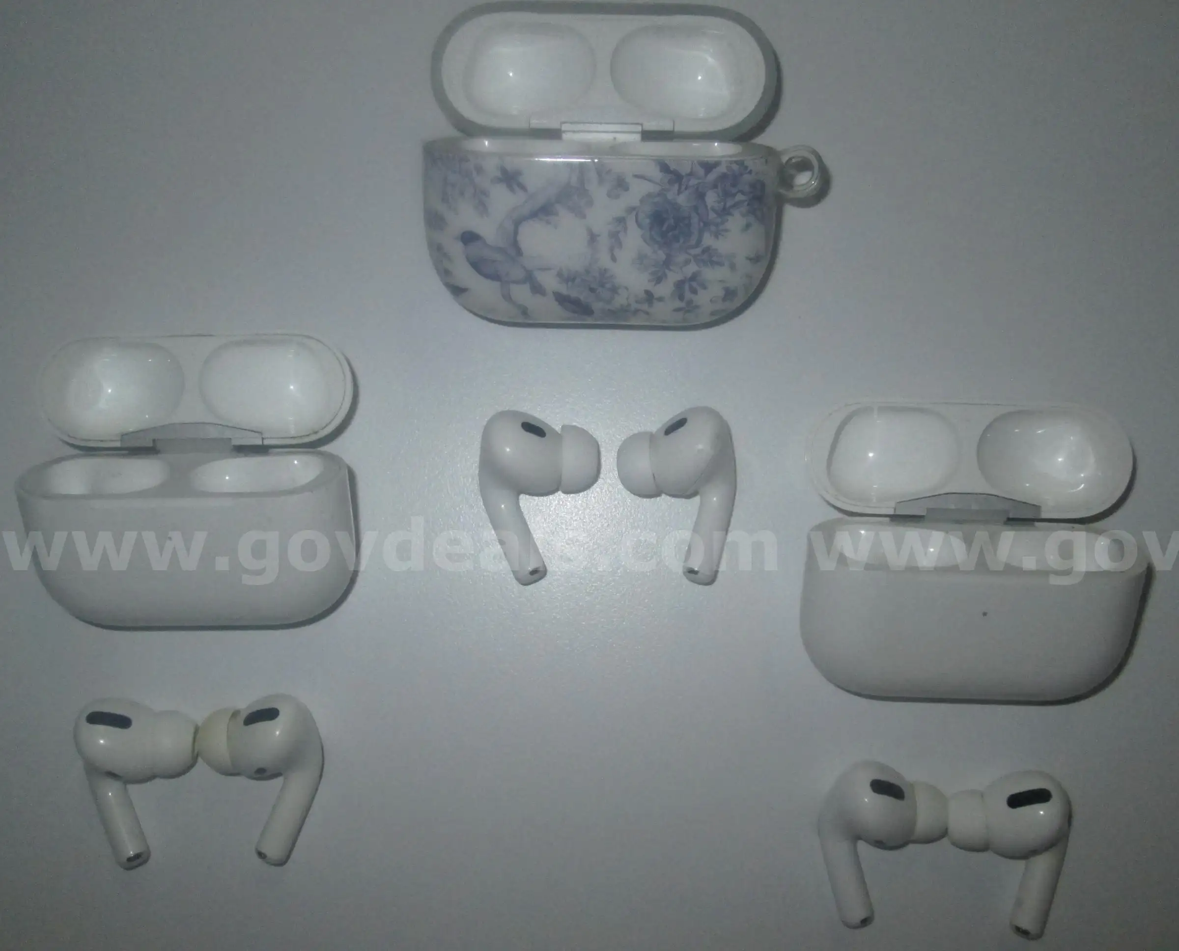 A lot of Apple Air Pods with charger and empty cases.