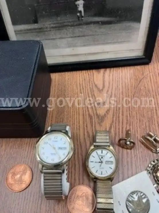 1 Small lot containing 2 watches cuff links 1 necklace 1 bracelet and a framed photo of The Catch