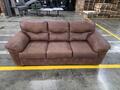 Ashley furniture brown three-seater sofa with a plush cushioned backrest