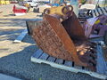 two backhoe buckets