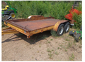 Tandem-axle flatbed equipment trailer