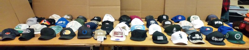 LOT # 132 TSA COLLECTION OF HATS IN SUITCASE